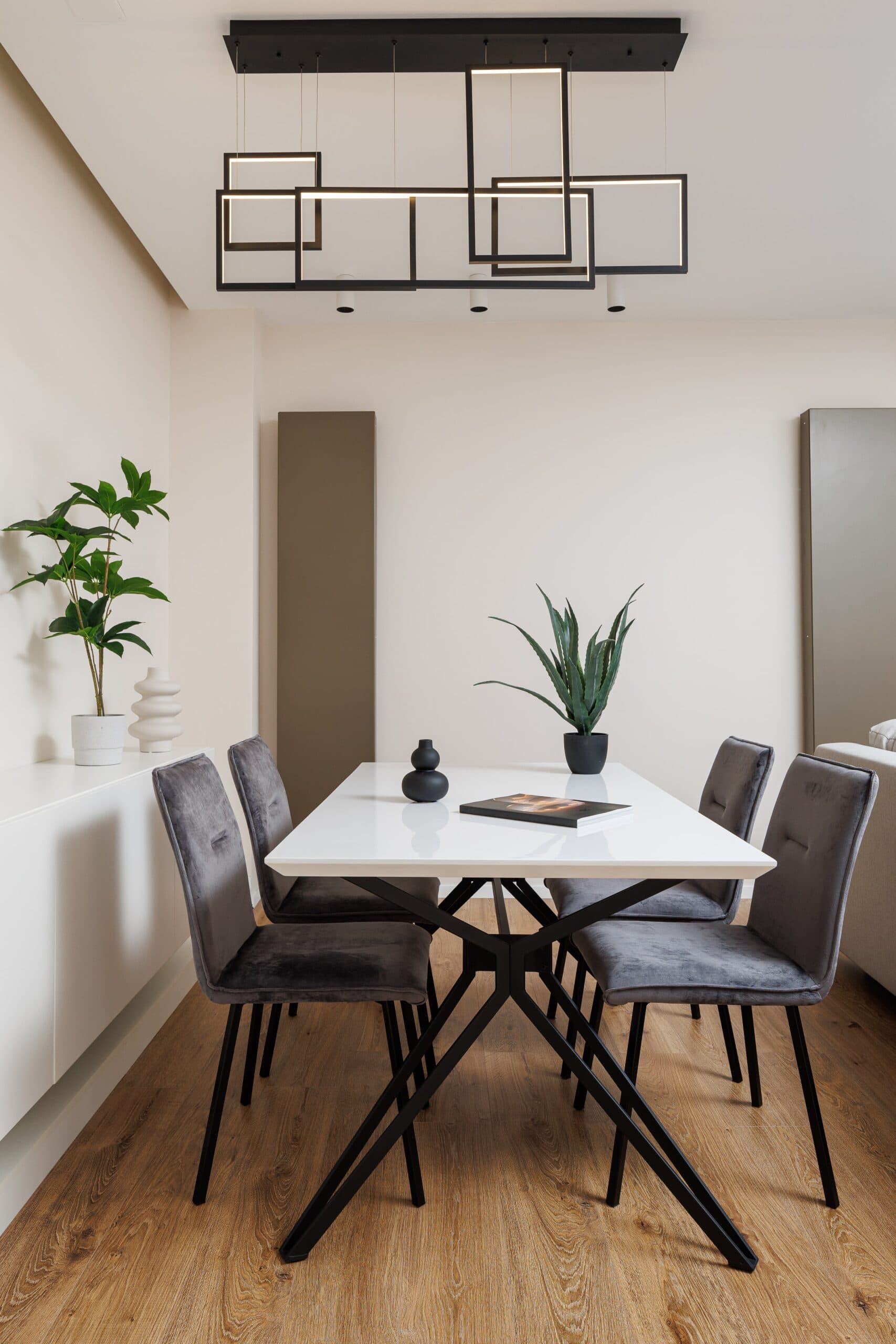 Modern dining area with designer lighting